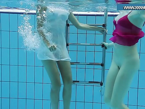 Hotly clothed teens in the pool